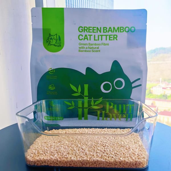 Green Bamboo Cat Litter packaging with a scoop of cat litter in front