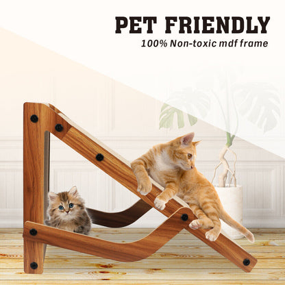Wooden cat scratching toy with two cats on a light wooden floor.